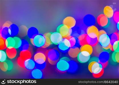 defocused background of christmas multicolored lights bokeh . christmas lights defocused background