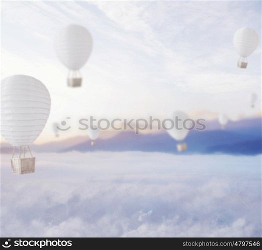 Defocused balloons over blue dreamy sky