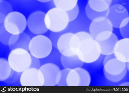Defocused blue holiday lights, may be used as background