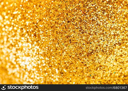 Defocused Bokeh twinkling lights Vintage background. Festive background with natural bokeh and bright golden lights.