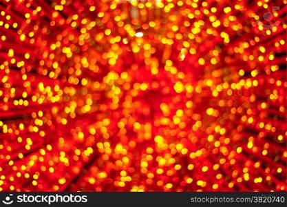 Defocused gold and red christmas lights background