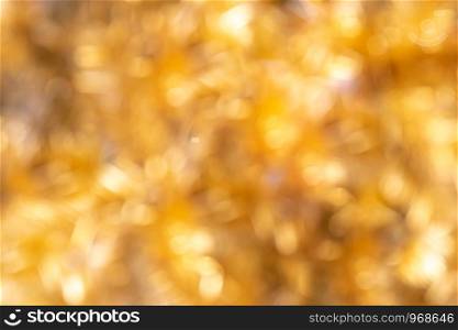 Defocused Golden Christmas Bokeh Background. Gold Holiday glowing