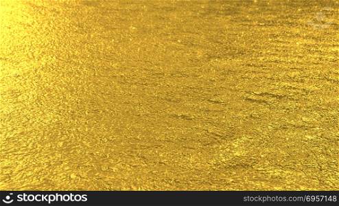 Defocused golden toned water surface background. Flecks of sunlight and ripples on the water. Water background. Water surface texture.. Defocused golden toned water surface texture background
