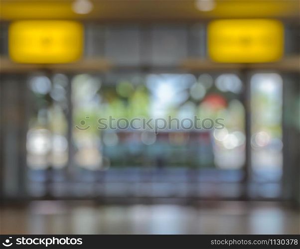 Defocused image of office, airport, hospital or shopping mall building door background