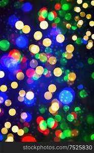 Defocused lights from christmas decorations. Abstract shiny multicolor background