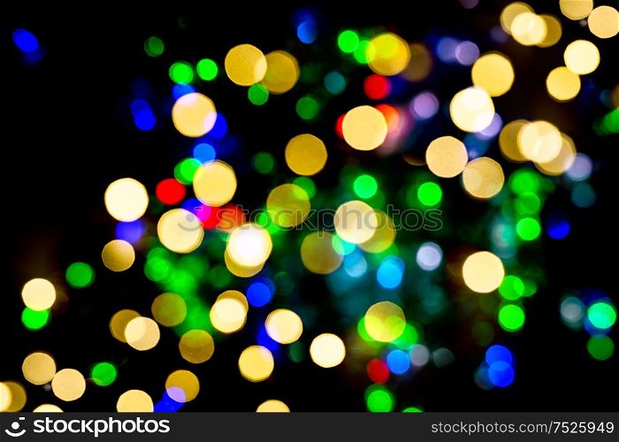 Defocused lights from christmas decorations. Abstract shiny multicolor background