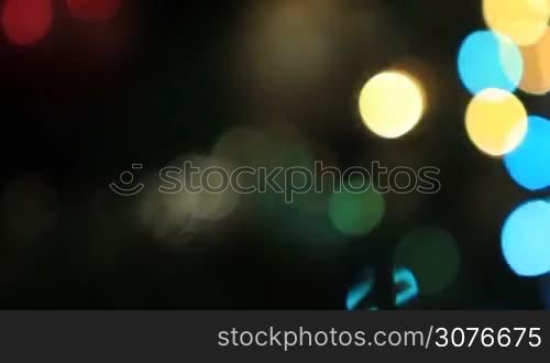 Defocused lights of Christmas tree. Colorful xmas bokeh