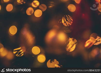 defocused shiny garland lights, winter holiday greeting card, background. background defocused shiny garland lights