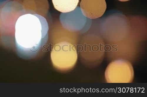 Defocused shot of night city and moving traffic lights. Bokeh background
