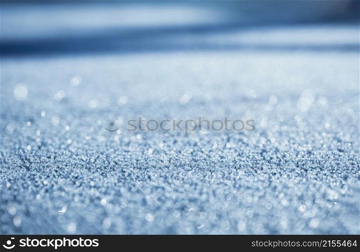 Defocused sunlight through frosty patterns on the road in winter, Selective focus bokeh reflection of Morning light shining, Glitter abstract for Chritmas holiday background