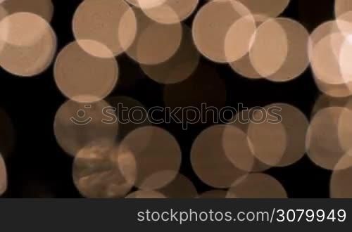 Defocused yellow holidays lights background. Dolly shot at 60fps.