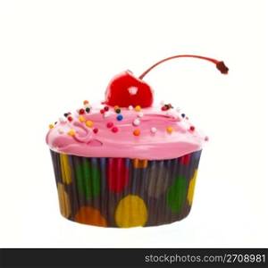 Delectable pink cupcake topped with a cherry and multi-colored sprinkles. Shot on white background.