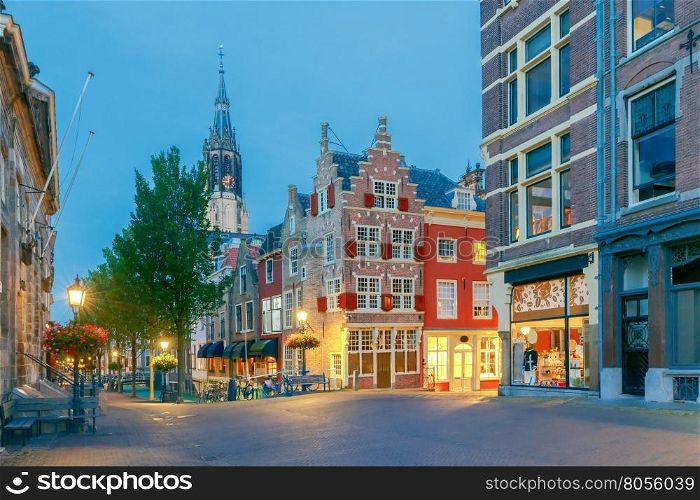 Delft. City street in night light.. Old medieval street with traditional Dutch houses at sunset. Delft. Netherlands.