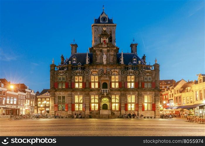Delft. Market Square.. The central market square and new church with a bell tower in the city Delft on sunset. Netherlands.