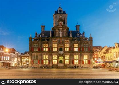 Delft. Market Square.. The central market square and new church with a bell tower in the city Delft on sunset. Netherlands.