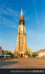 Delft. Old church with a bell tower.. The old medieval church in the market square in Delft. Netherlands.