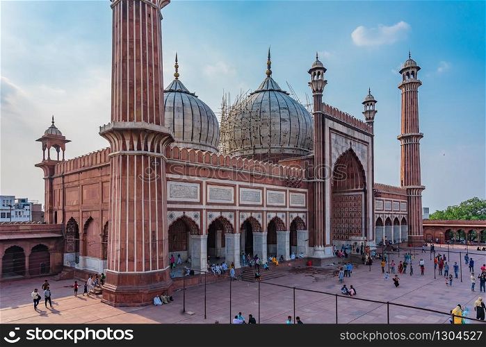 DELHI, INDIA - APRIL 19, 2019: The red Jama Mosque (Masjid Jahan Numa), built in the 17th in Mughal architecture, is one of the largest mosques in India. It has been the site of two terror attacks.
