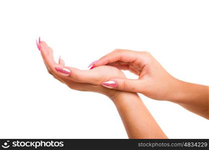 Delicate and well-manicured hands being massaged and rubbed together