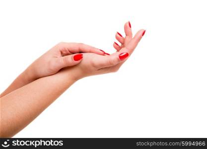 Delicate and well-manicured hands being massaged and rubbed together