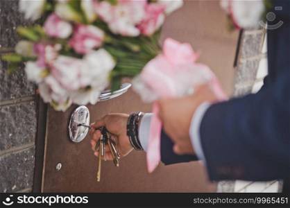 Delicate bouquet of pink and white flowers in the hands of the bride.. Beautiful bride bouquet in her hands closeup 2147.