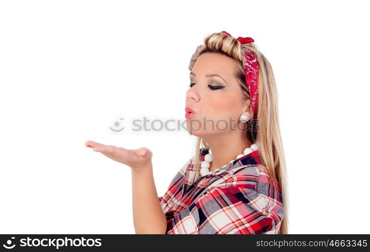Delicate girl blowing her hand in pinup style isolated on a white background
