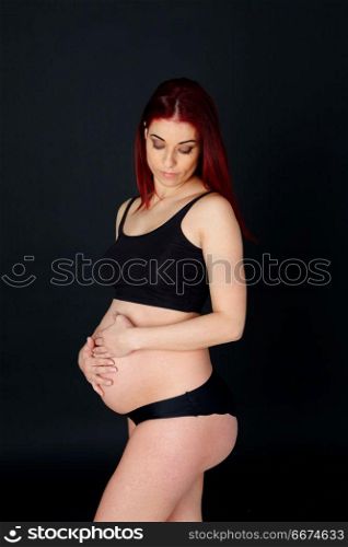 Delicate image of a pretty pregnant woman . Delicate image of a pretty pregnant woman with black background