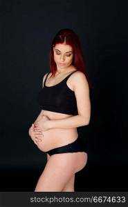 Delicate image of a pretty pregnant woman . Delicate image of a pretty pregnant woman with black background