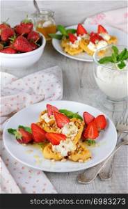 Delicate, melting mouth-watering Belgian waffles with whipped cream, strawberries, flavored with peanuts and honey. What could be better for breakfast.
