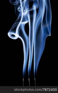 delicate smoke plumes, puffs and eddies from burning incense sticks