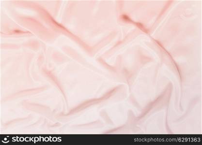 delicate waves of satin pink silk close up