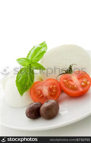 deliciious buffalo mozzarella with cutted cherry tomatoes on white isolated backgroundl