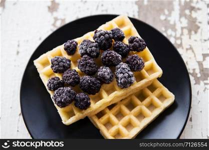 Delicious and beautiful Belgian waffles with blackberries.. Belgian waffles with blackberry