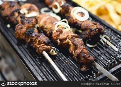 delicious and fragrant meat, skewers on grill 