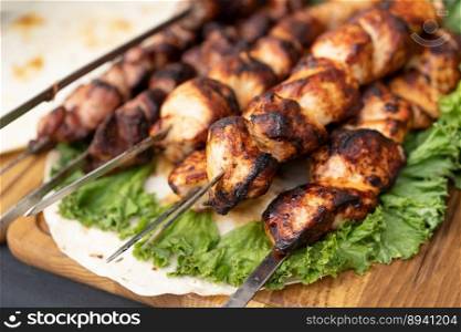delicious and fragrant meat, skewers on grill 