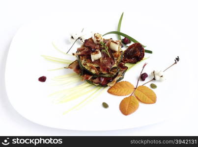 Delicious appetizer with fried potato pancakes, zucchini slices and crispy bacon