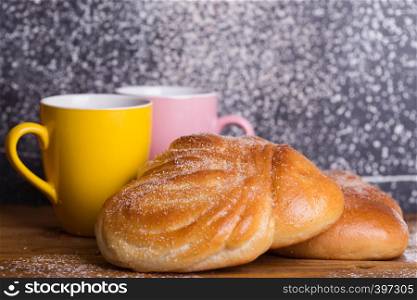 delicious appetizing buns and coffee for breakfast