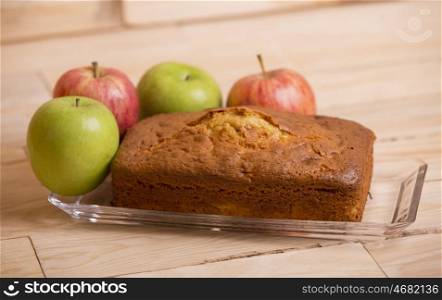 Delicious apple cake on wooden table