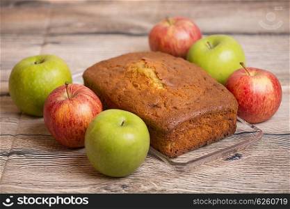 Delicious apple cake on wooden table