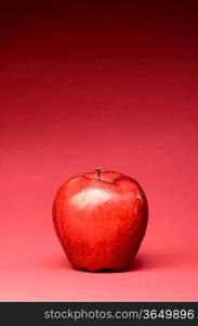 delicious apple on red background