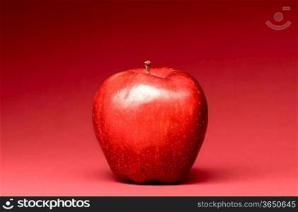 delicious apple on red background