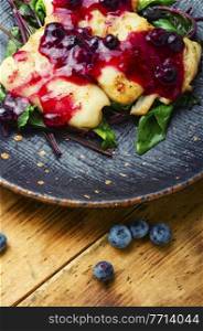 Delicious baked fish with berry sauce. Stewed pangasius with blueberries. Baked pangasius fish with blueberries