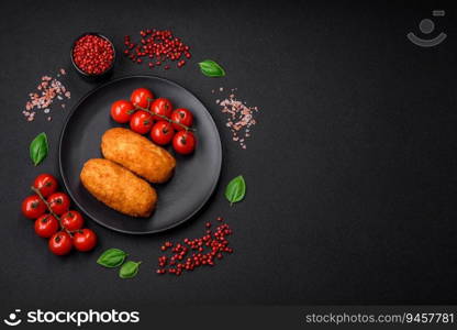 Delicious baked potato cutlet stuffed with chicken and vegetables, spices and salt on a dark concrete background