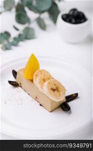 Delicious banana chocolate cake on white plate