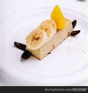 Delicious banana chocolate cake on white plate
