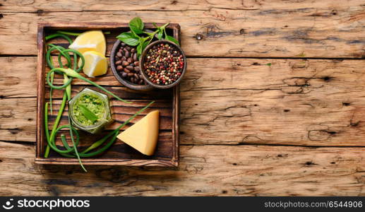 Delicious basil pesto sauce. Pesto sauce in bowl with pine nuts, parmesan and garlic