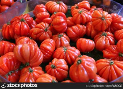 Delicious big red tomatoes at the market