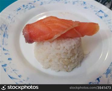 Delicious bowl of white rice with salmon