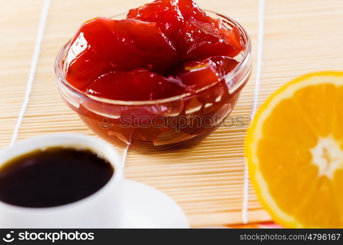 Delicious breakfast. Croissants jelly and cup of coffee on breakfast table