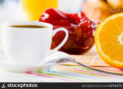 Delicious breakfast. Croissants jelly and cup of coffee on breakfast table