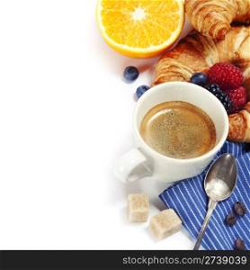 Delicious breakfast with fresh coffee, fresh croissants and fruits